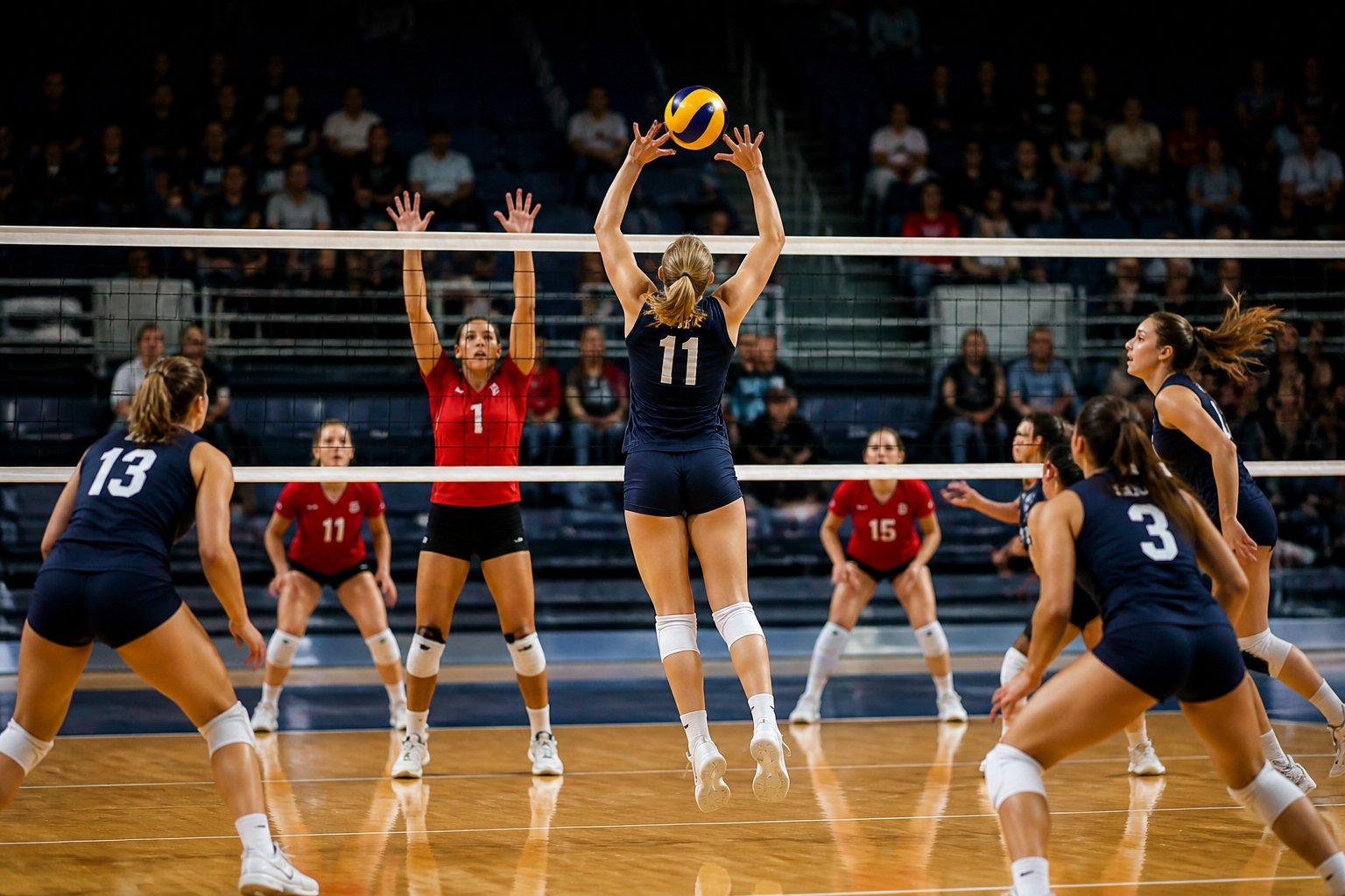 Volleyball players coordinate an intense attack during an indoor match.